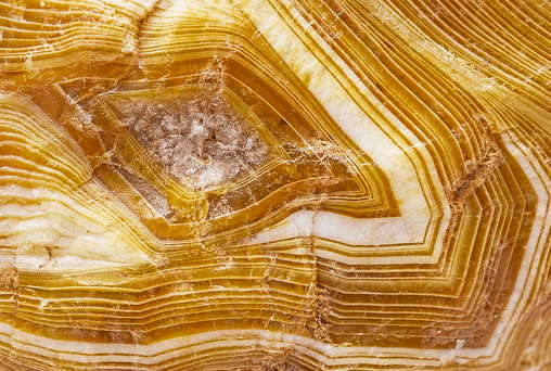 Striped yellow and white agate texture.