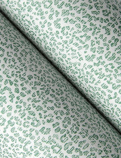 Green textured fabric with pattern.