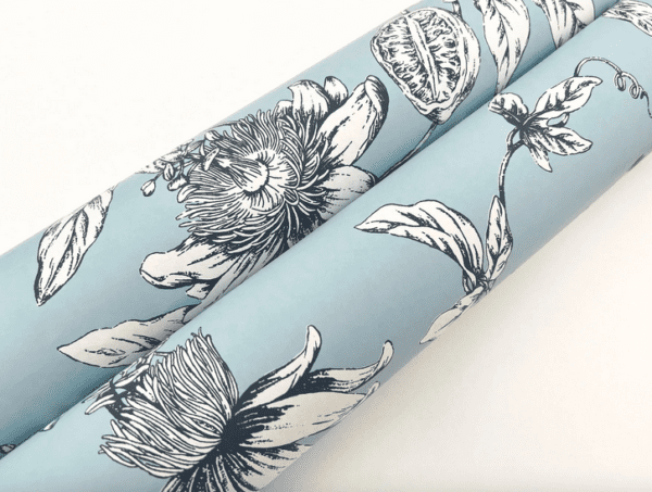 Here's an alt tag for the image: Blue floral wrapping paper, passionflower print.