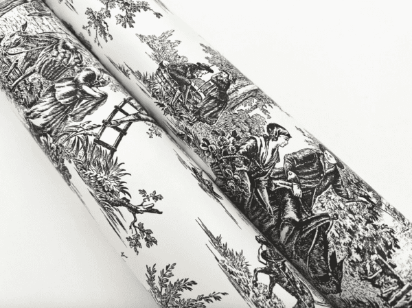 Black and white toile fabric roll.