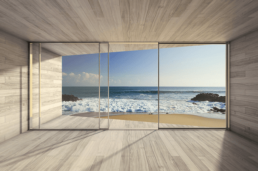 Ocean view through large sliding doors.