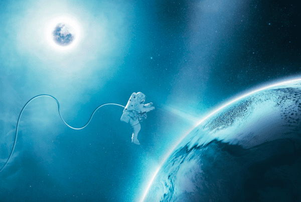 Astronaut spacewalking near a planet.