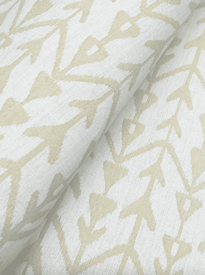 Beige ikat fabric with arrow pattern.