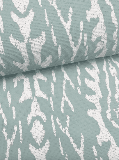 Teal fabric with white ikat pattern.