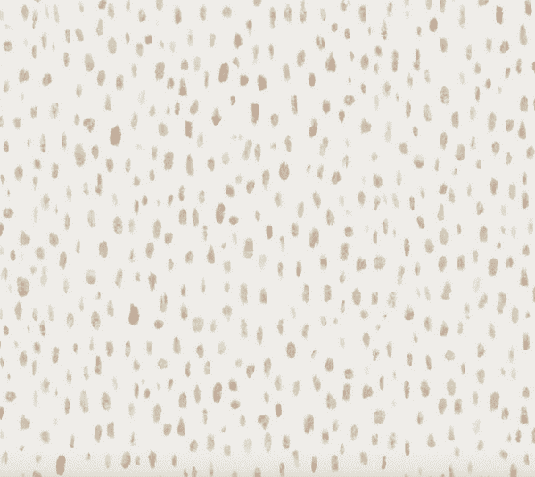 Beige speckled pattern background texture.