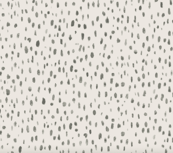 Gray speckled pattern on beige background.