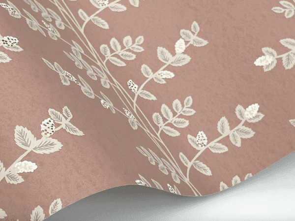 Dusty rose wallpaper with floral pattern.