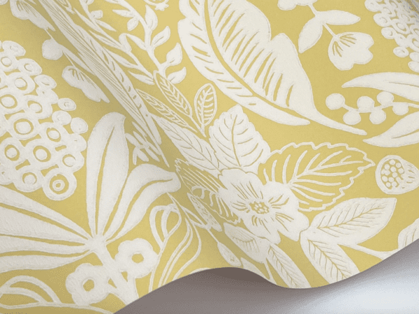 Yellow floral wallpaper with white pattern.