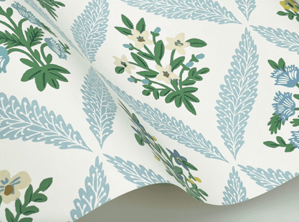 Floral wallpaper with blue and green leaves.