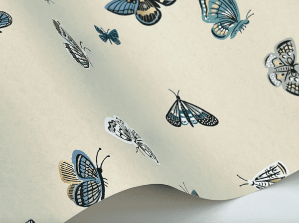 Beige wallpaper with teal butterflies.