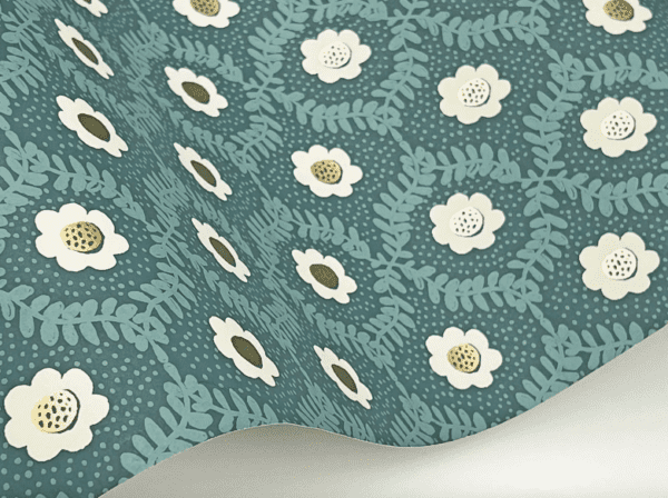 Teal floral wallpaper with white flowers.