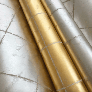 Gold and silver metallic wallpaper rolls.