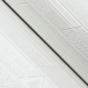 White textured wall paneling detail.