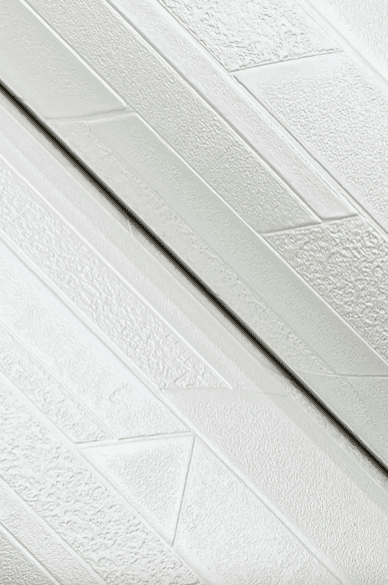 White textured wall paneling detail.