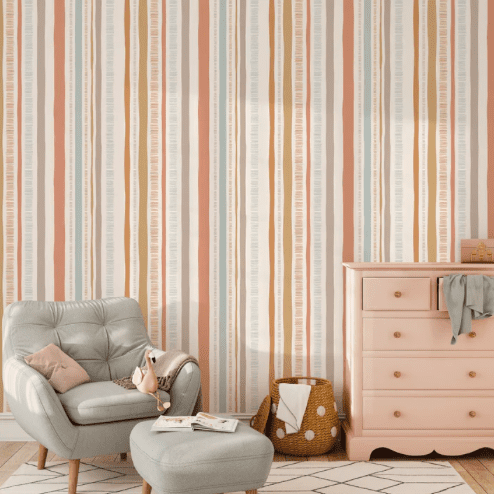 Pastel striped wallpaper in nursery.