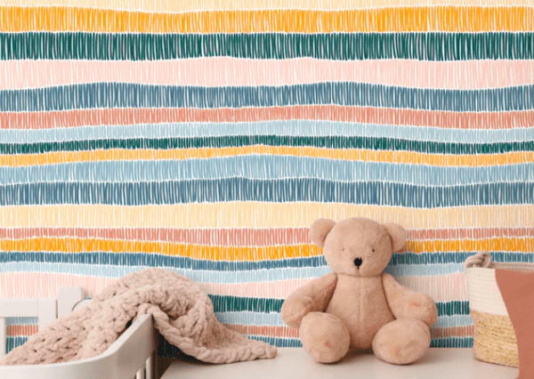 Pastel striped wallpaper with teddy bear.