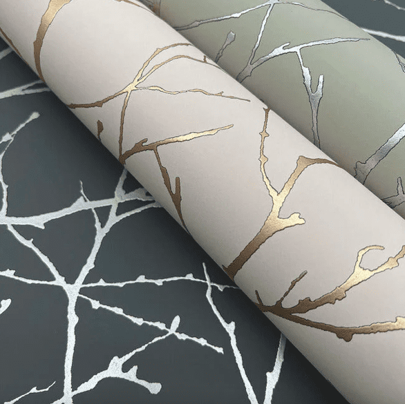 Metallic branch wallpaper rolls.