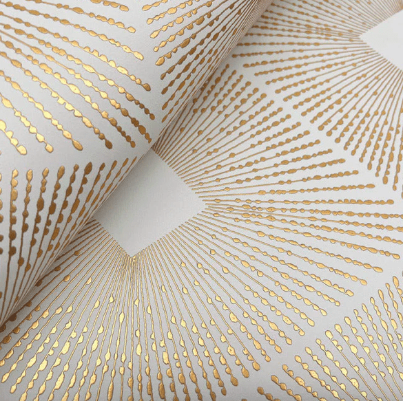 Gold sunburst pattern wallpaper roll.