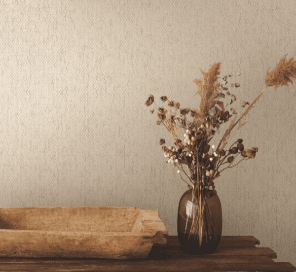 Dried flowers in vase, wooden bowl.