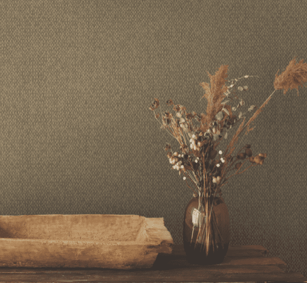 Dried flowers in vase, wooden bowl.