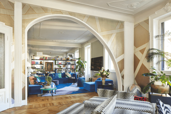 Chic apartment living room with blue sofas.